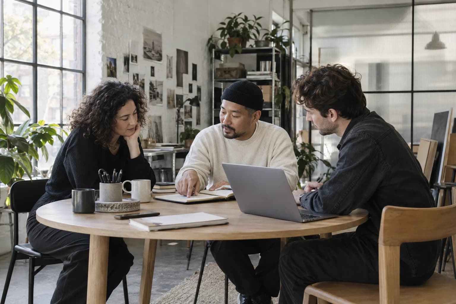 Three colleagues planning the day together